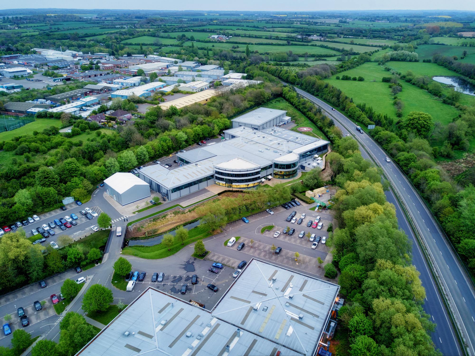 Recruitment Agency in Brackley|Racing bicycle in blurred motion speeding down the road.|Brackley recruitment agency supporting many automotive businesses in the area.|Recruitment agency in Brackley with great transport links.